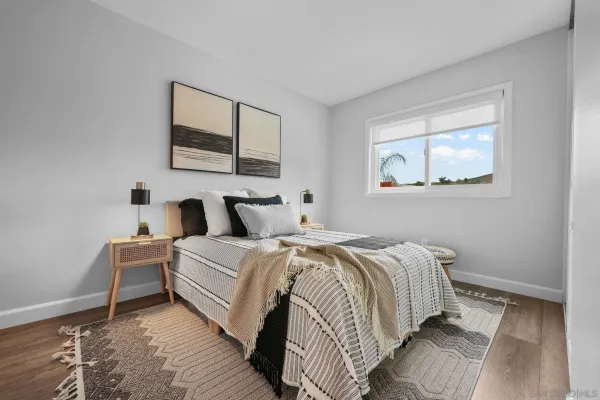 a bed room with a bed and a night stand