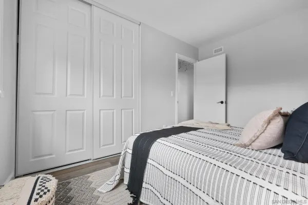 a bedroom with a bed and with curtain