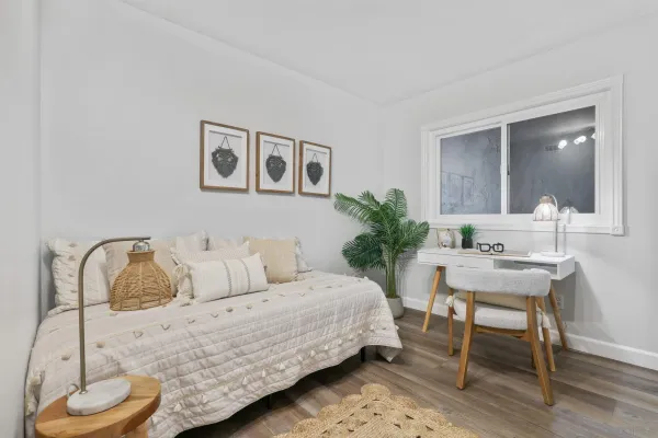 a bedroom with a bed and a chair