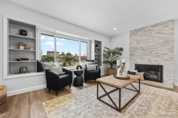 a living room with furniture and a fireplace