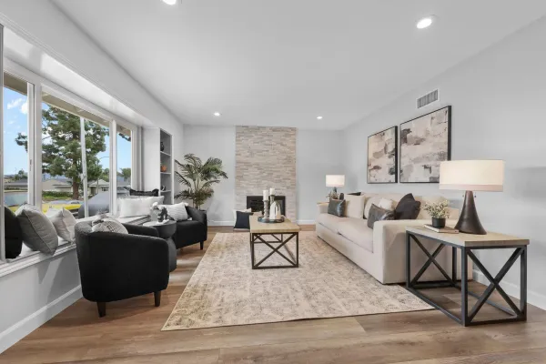 a living room with furniture and a fireplace