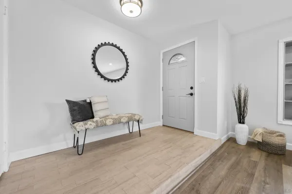 a bedroom with a bed and a mirror