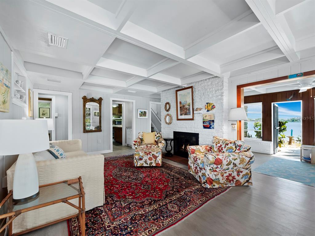 1620 Casey Key Road Nokomis, FL 34275 - Photo 12 of 49 a living room with furniture fireplace and a table