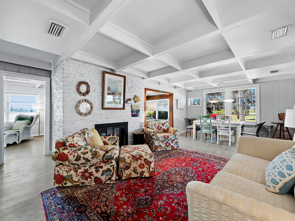 1620 Casey Key Road Nokomis, FL 34275 - Photo 13 of 49 a living room with furniture fireplace and a window
