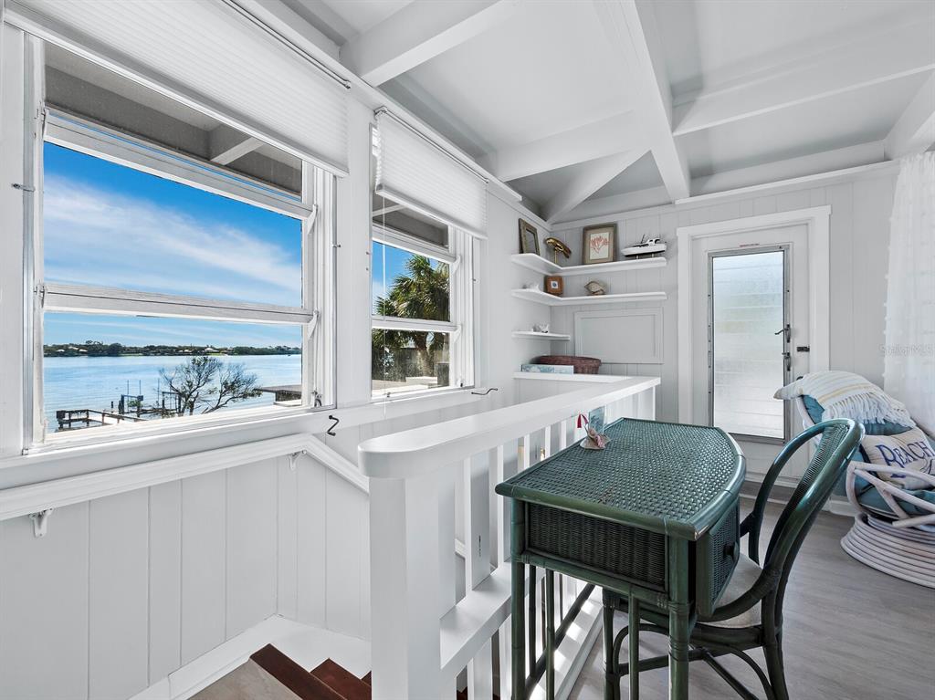 1620 Casey Key Road Nokomis, FL 34275 - Photo 19 of 49 a view of a dining room with furniture and window