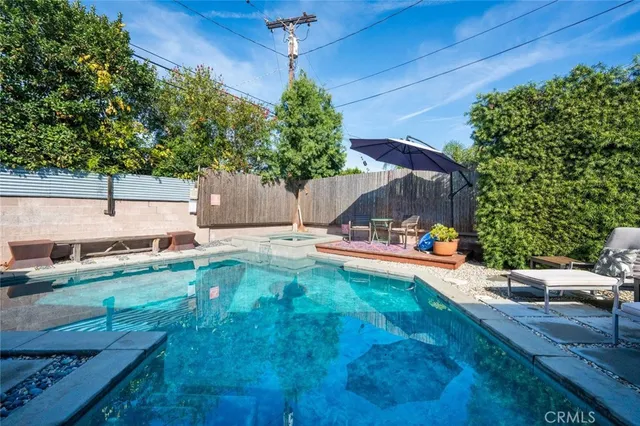 a view of a backyard with a sitting area
