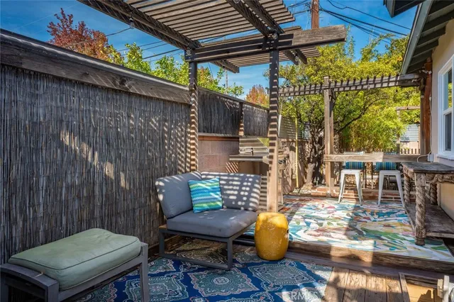 a backyard of a house with outdoor seating