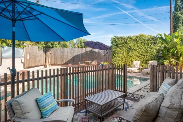 a view of a chair and tables in the balcony