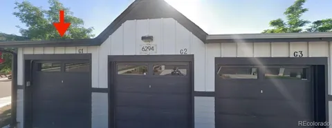 a front view of a house with garage
