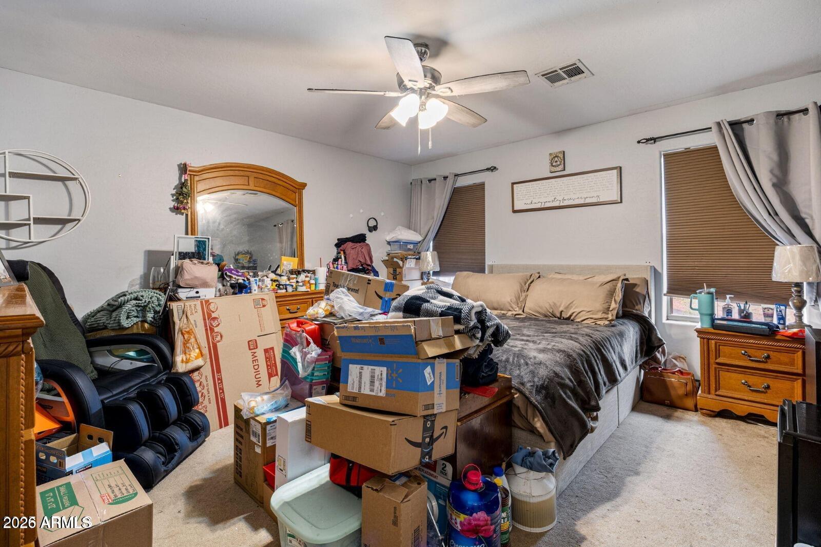 2870 Mustang Trail Overgaard, AZ 85933 - Photo 16 of 17 a bed room with a bed and a mirror