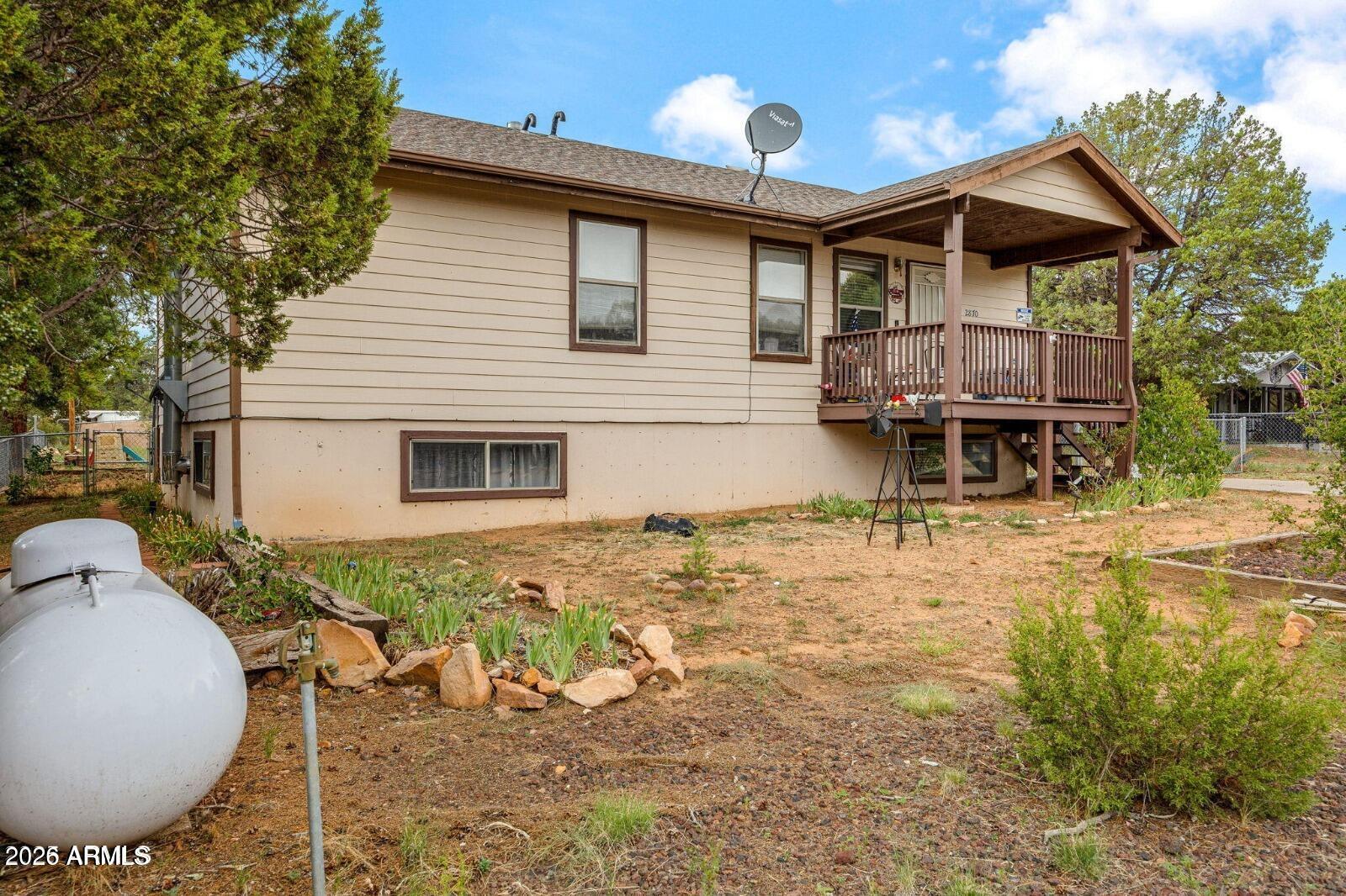 2870 Mustang Trail Overgaard, AZ 85933 - Photo 17 of 17 a view of a house with backyard