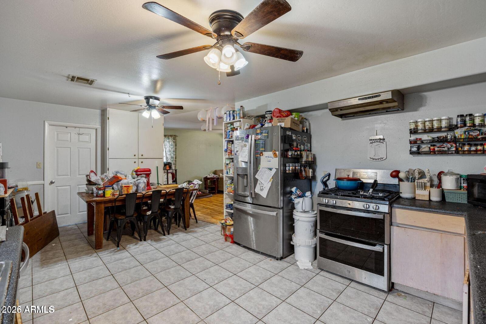 2870 Mustang Trail Overgaard, AZ 85933 - Photo 5 of 17 a kitchen with refrigerator and cabinets