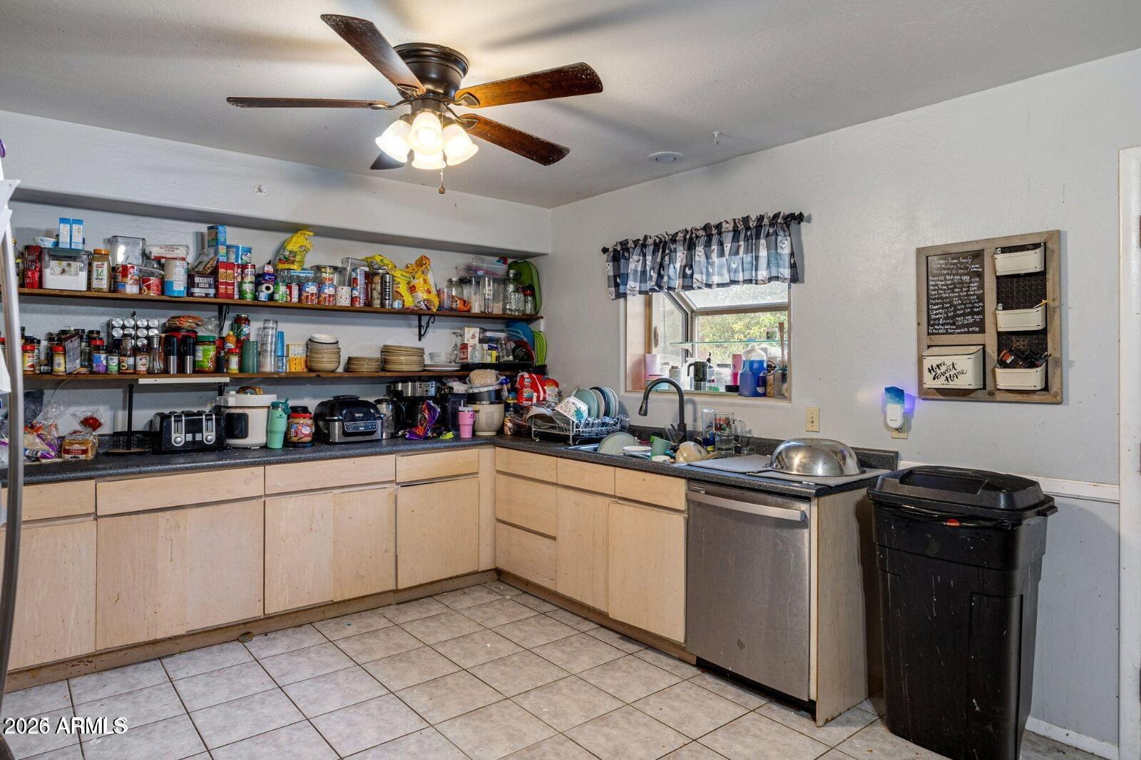 2870 Mustang Trail Overgaard, AZ 85933 - Photo 6 of 17 a kitchen with stainless steel appliances granite countertop a sink and cabinets