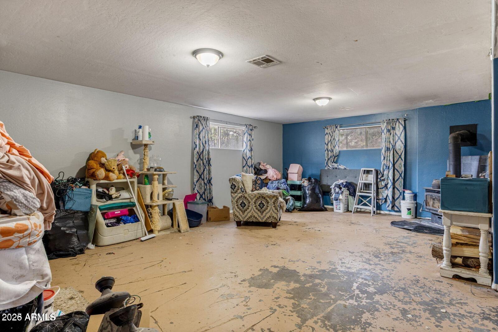 2870 Mustang Trail Overgaard, AZ 85933 - Photo 8 of 17 a view of a room with lots of storage and bicycles
