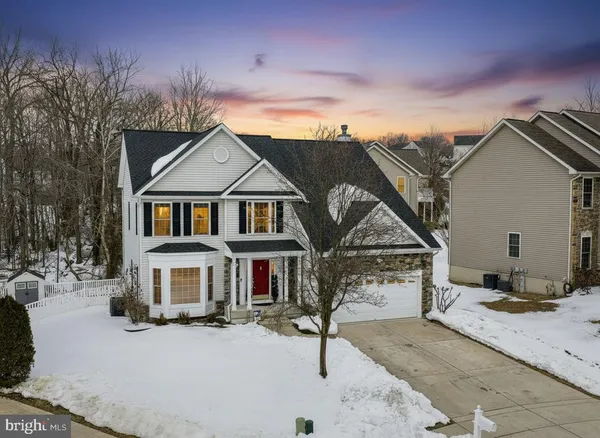 a front view of a house with yard