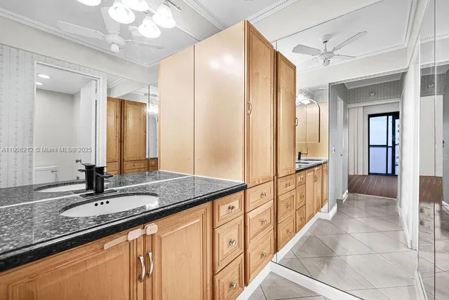 a white toilet sitting next to a bath tub