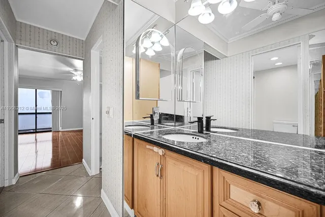 a white toilet sitting next to a bath tub