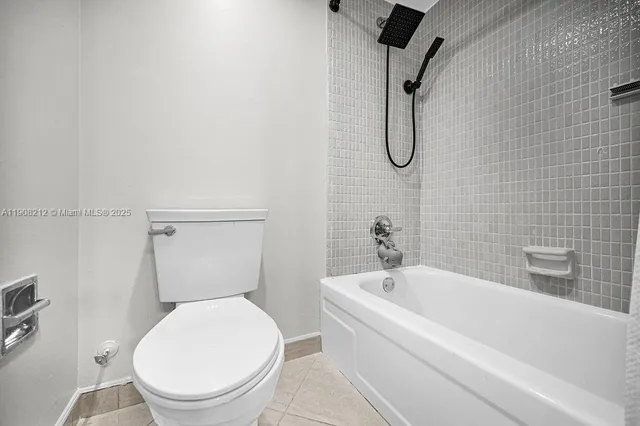 a kitchen with granite countertop white cabinets and sink