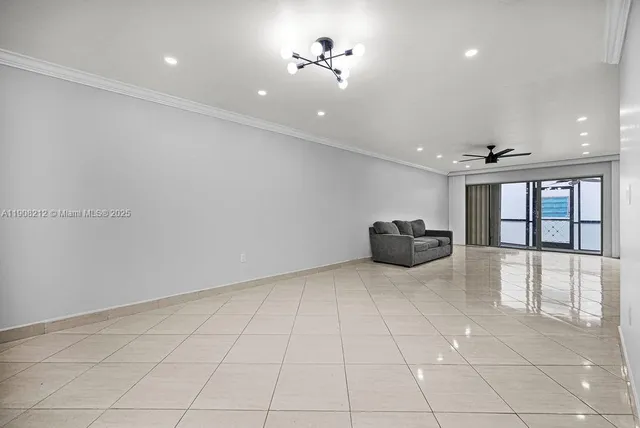 a living room with furniture and large window
