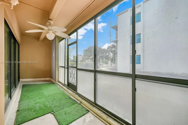 a view of a cars park in front of a building