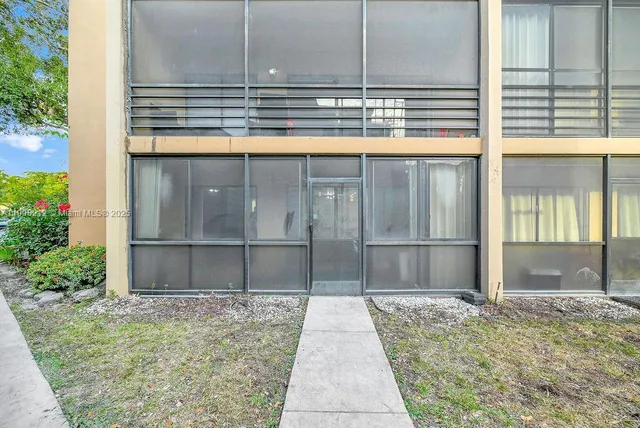 a patio with a yard table and chairs
