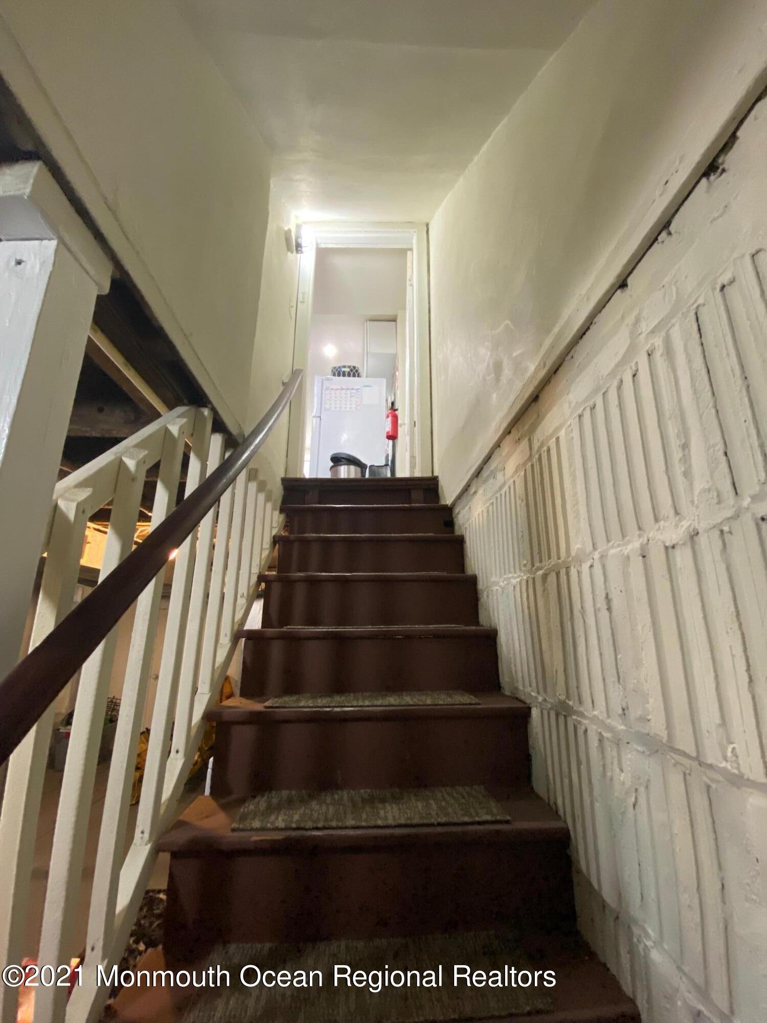 3107 Kearsarge Road Camden, NJ 08104 - Photo 32 of 39 3107 kearsarge basement view up stairs