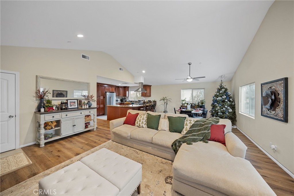 65 Tennessee Street Redlands, CA 92373 - Photo 11 of 23 a living room with furniture and a dining table with kitchen view