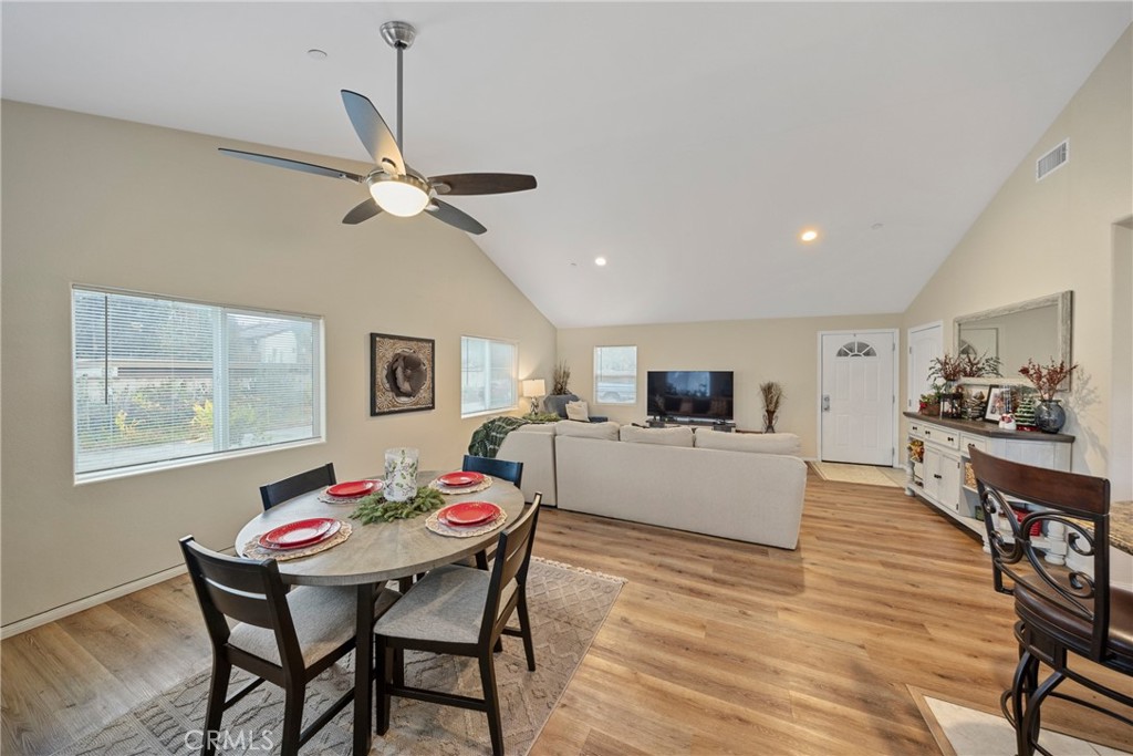 65 Tennessee Street Redlands, CA 92373 - Photo 13 of 23 a living room with furniture kitchen view and a wooden floor