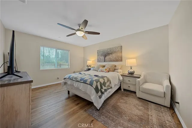 a bedroom with a bed lamp and a fireplace