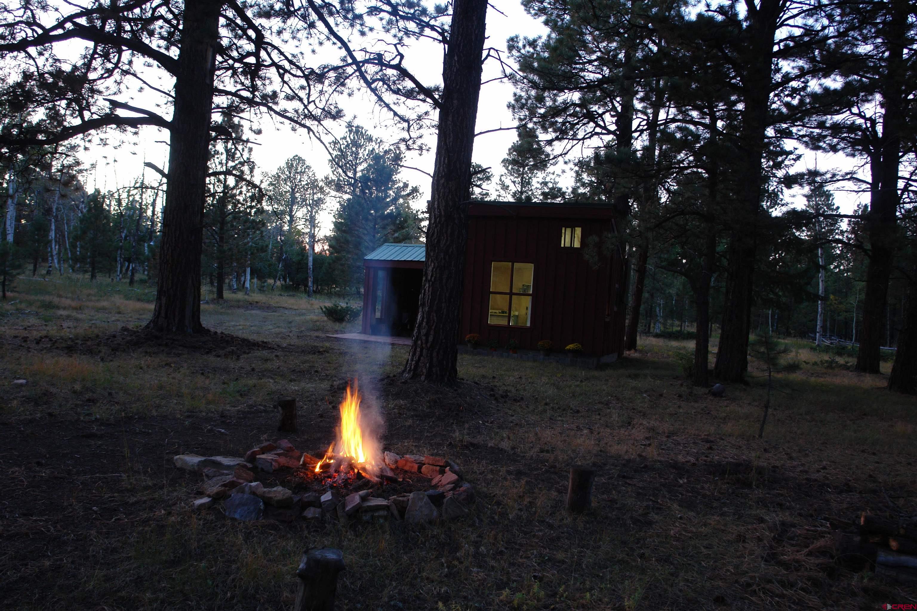 80 West Piney Woods Way Ridgway, CO 81432 - Photo 26 of 35 a lake view with table and chairs