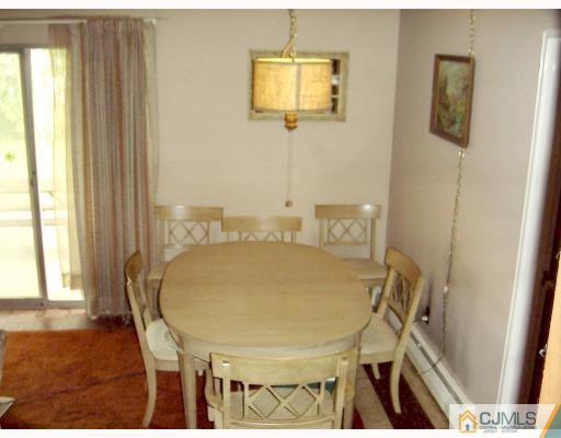 27 Sims Road Edison, NJ 08817 - Photo 3 of 9 a workspace with furniture and window