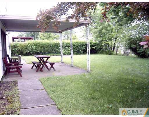 27 Sims Road Edison, NJ 08817 - Photo 7 of 9 a view of a backyard with sitting area