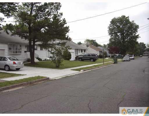 27 Sims Road Edison, NJ 08817 - Photo 9 of 9 a view of road with card parked on side and road
