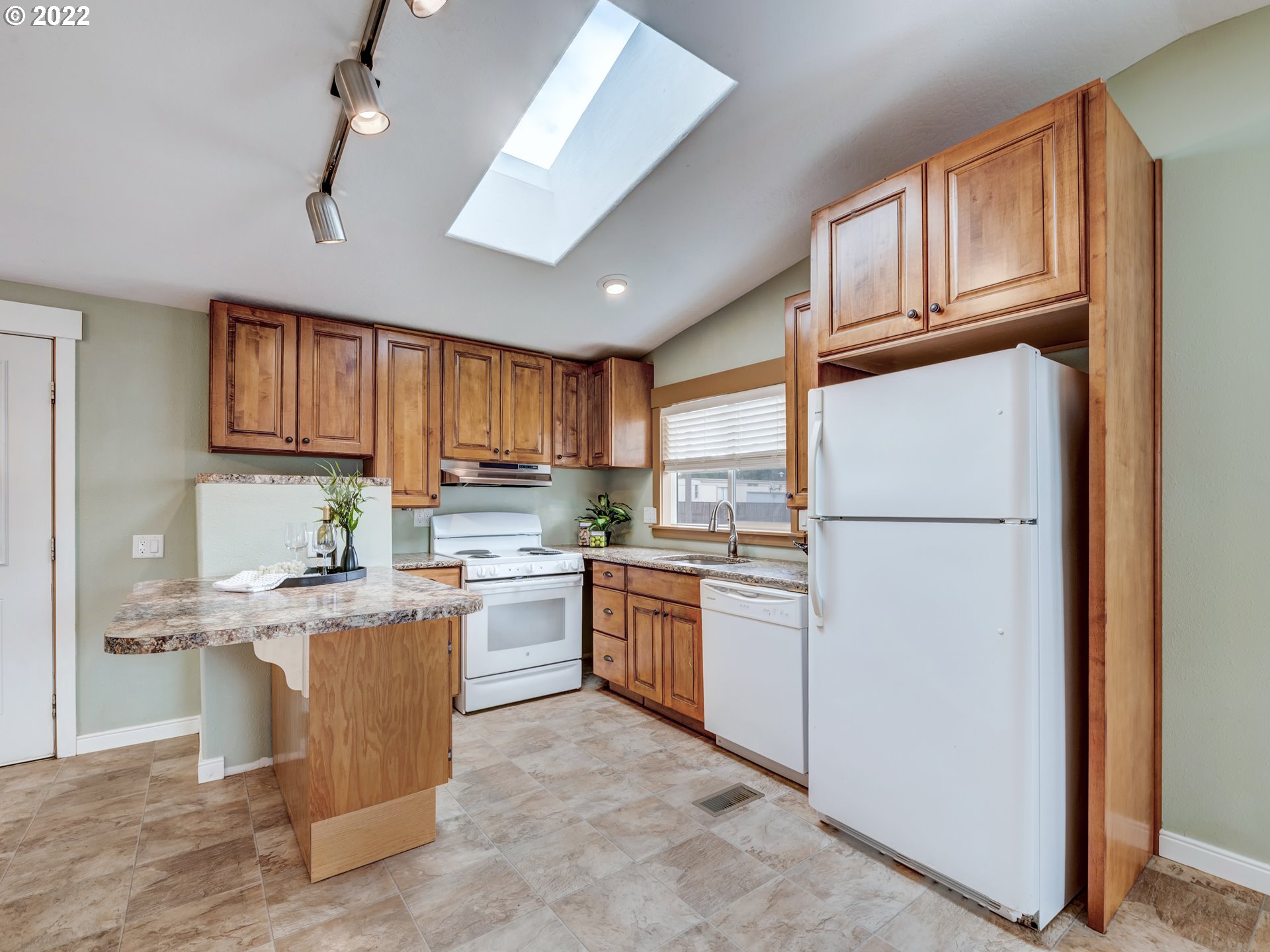 452 South 53rd Street Springfield, OR 97478 - Photo 11 of 26 a kitchen with cabinets stainless steel appliances and a window