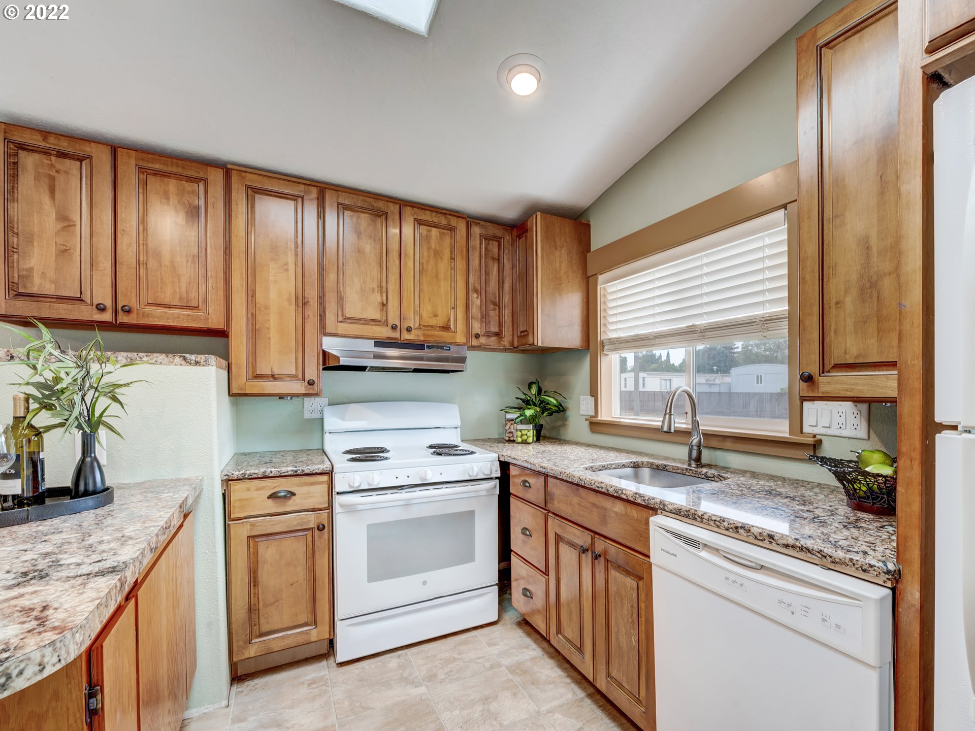 452 South 53rd Street Springfield, OR 97478 - Photo 12 of 26 a kitchen with a sink stove top oven and cabinets
