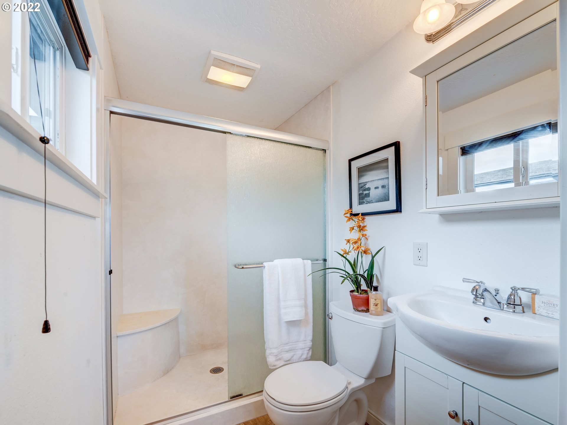 452 South 53rd Street Springfield, OR 97478 - Photo 14 of 26 a white toilet sitting next to a bathroom sink