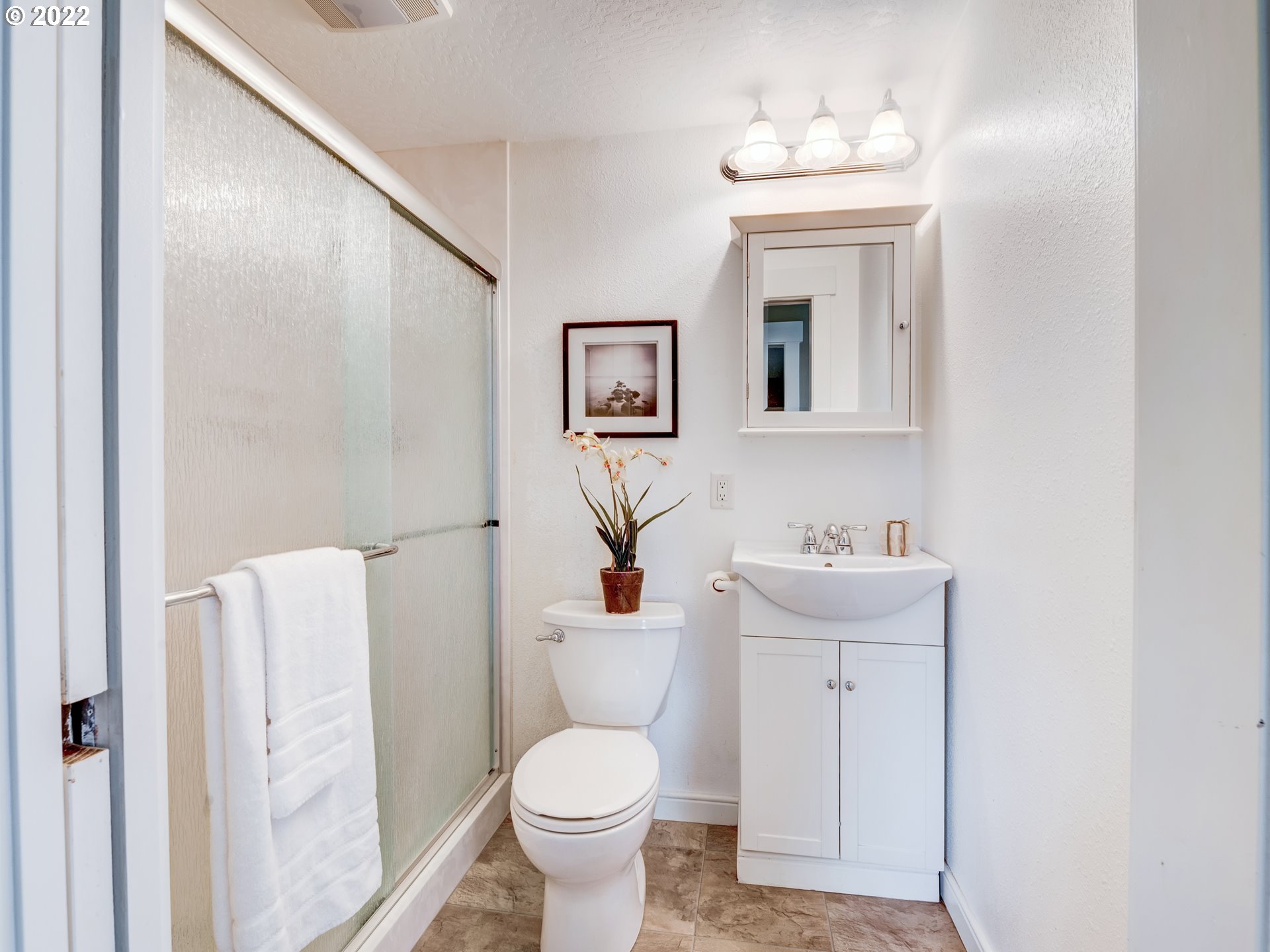 452 South 53rd Street Springfield, OR 97478 - Photo 15 of 26 a white toilet sitting next to a bathroom sink
