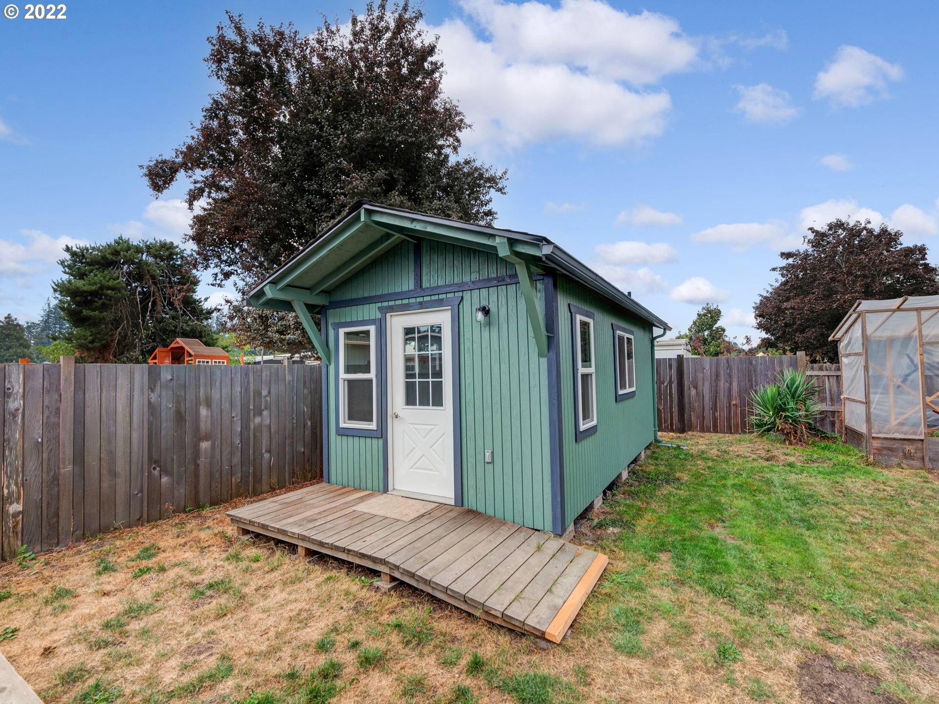 452 South 53rd Street Springfield, OR 97478 - Photo 16 of 26 a view of a house with wooden fence next to a yard