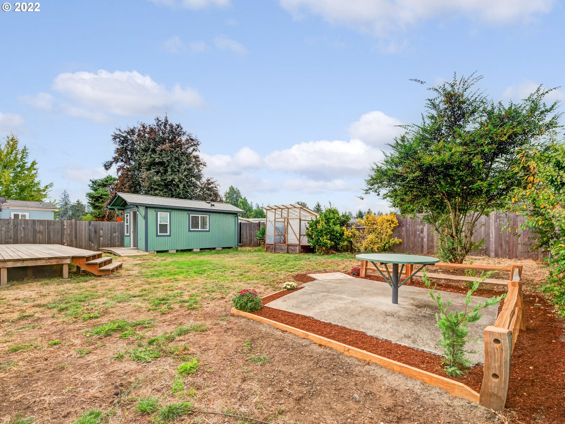 452 South 53rd Street Springfield, OR 97478 - Photo 20 of 26 a backyard of a house with table and chairs