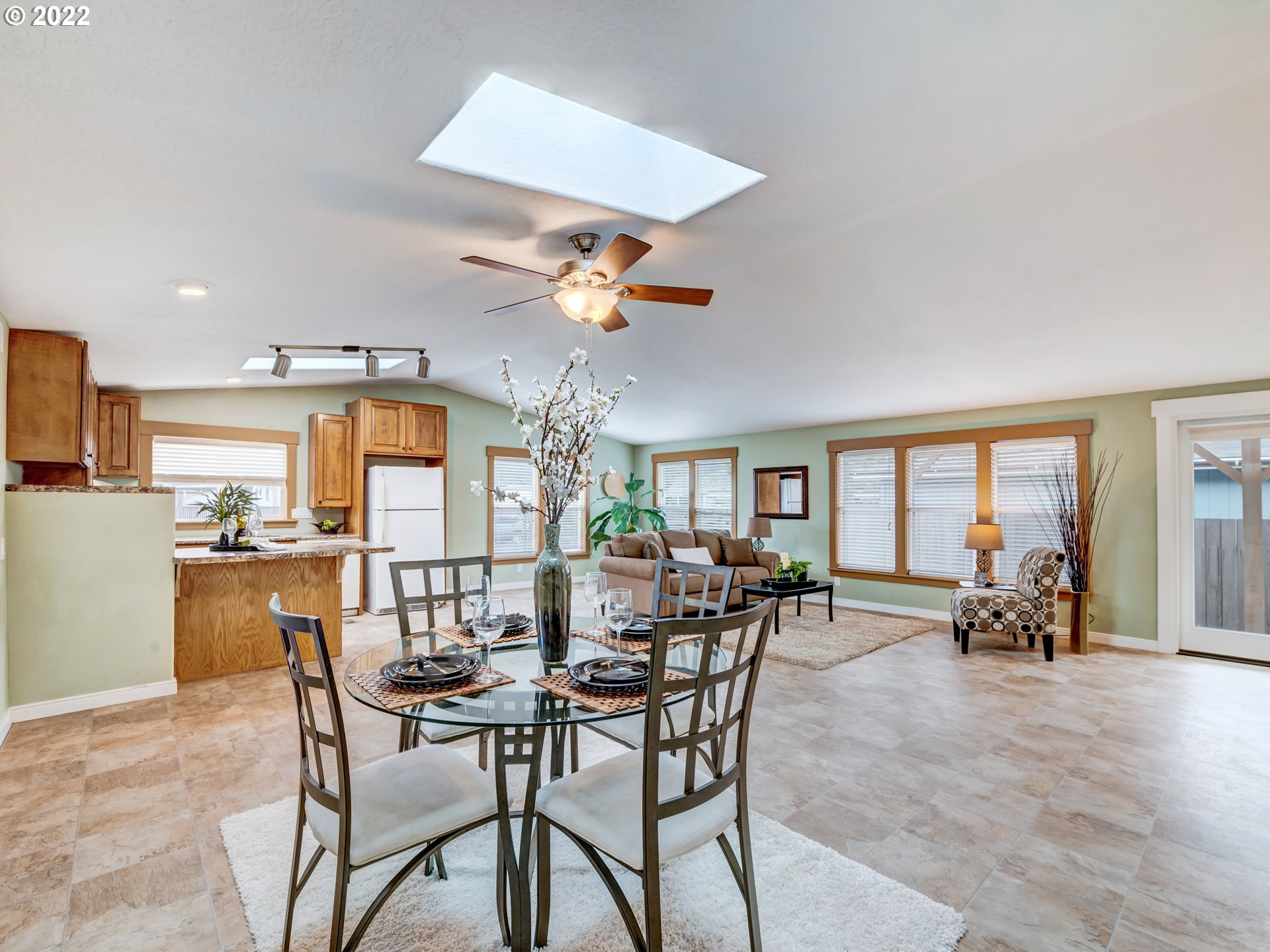452 South 53rd Street Springfield, OR 97478 - Photo 8 of 26 a view of a dining room with furniture a chandelier and large windows