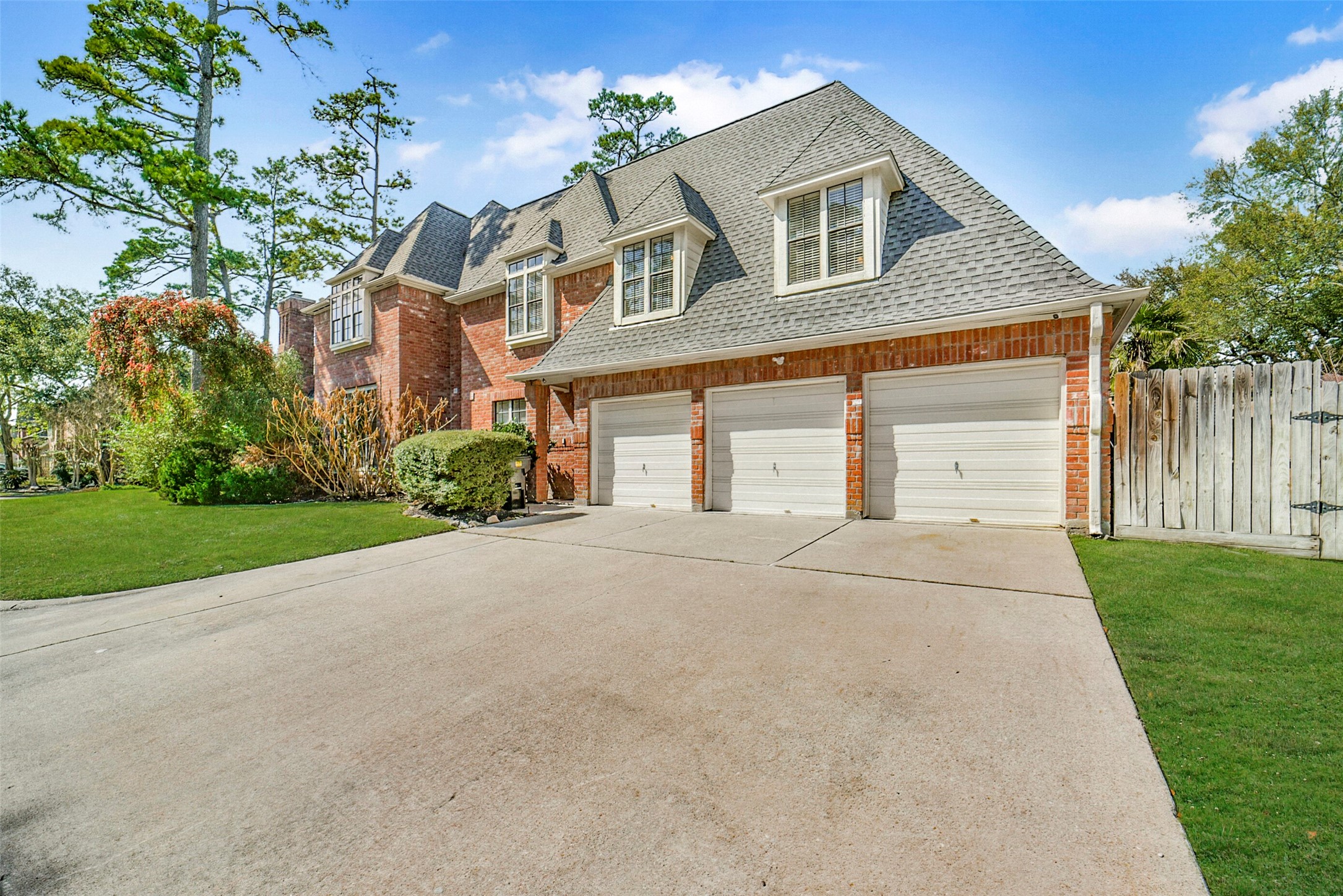 17302 Atherington Place Spring, TX 77379 - Photo 3 of 50 Spacious 3-car garage offering functionality and storage. Entrance to garage is on the side of the home offering a gorgeous front view!