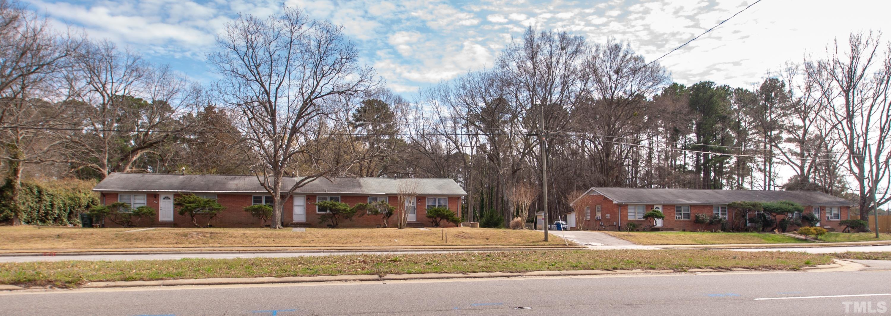 4260 Louisburg Road Raleigh, NC 27604 - Photo 3 of 22 a front view of a building with trees