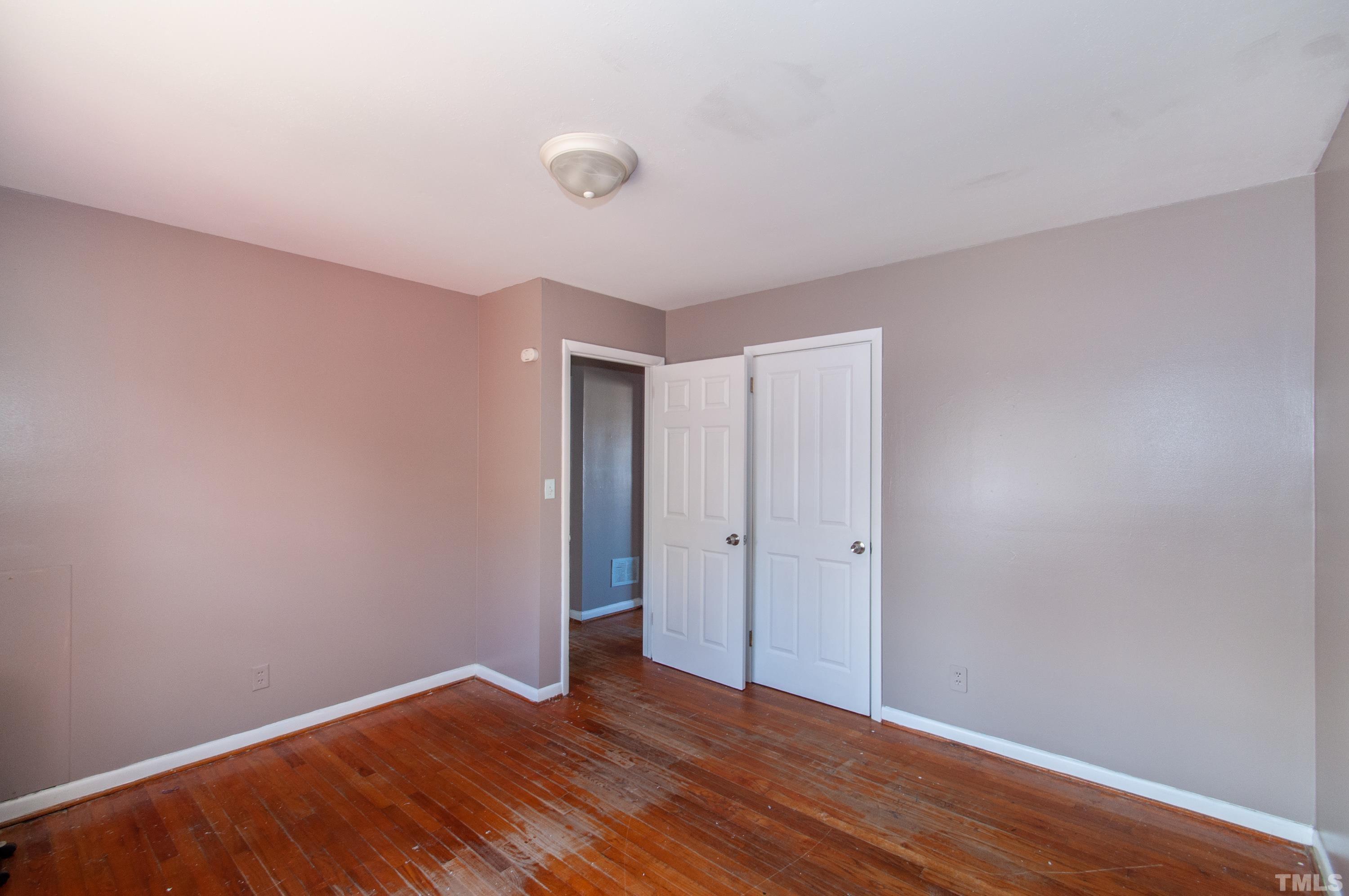 4260 Louisburg Road Raleigh, NC 27604 - Photo 7 of 22 a view of an empty room with wooden floor