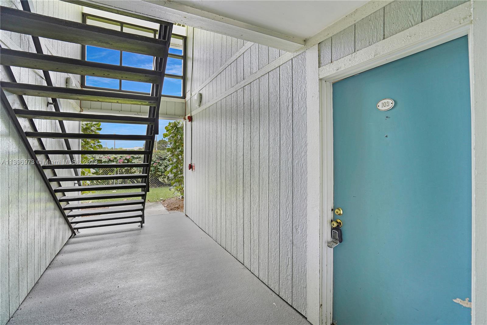 9727 Hammocks Boulevard, Unit 103D Miami, FL 33196 - Photo 13 of 19 a view of a hallway