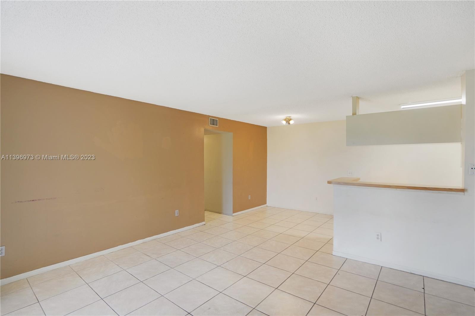 9727 Hammocks Boulevard, Unit 103D Miami, FL 33196 - Photo 18 of 19 a view of an empty room
