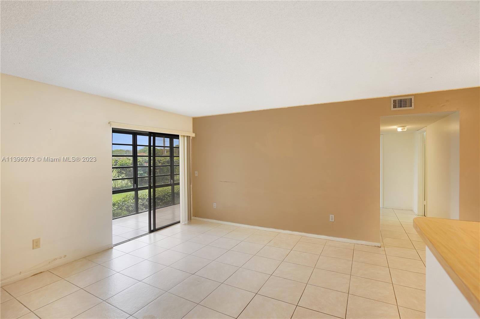 9727 Hammocks Boulevard, Unit 103D Miami, FL 33196 - Photo 19 of 19 a view of an empty room with a window