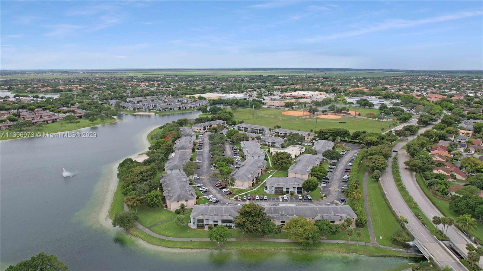 9727 Hammocks Boulevard, Unit 103D Miami, FL 33196 - Photo 4 of 19 an aerial view of multiple house