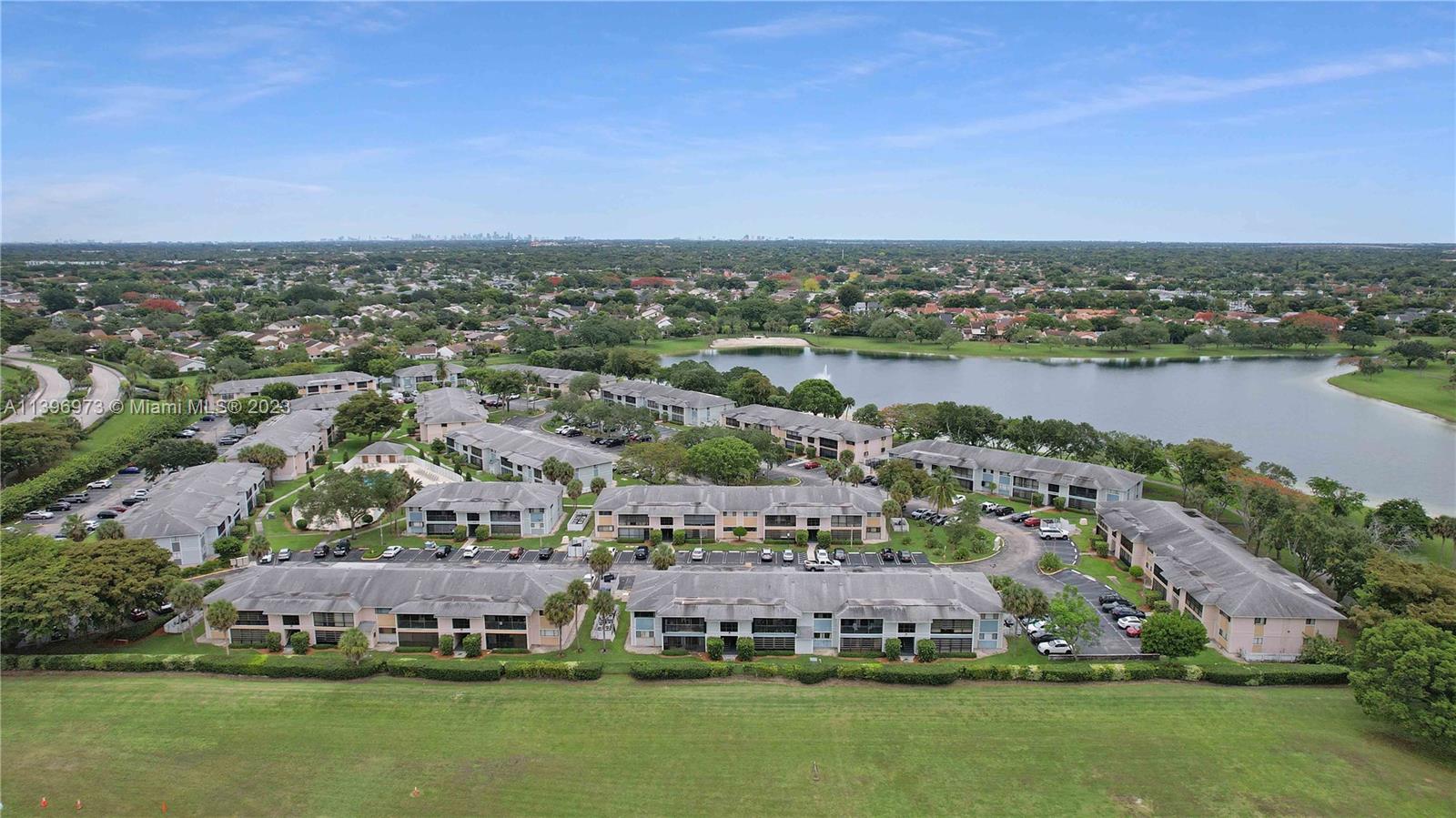 9727 Hammocks Boulevard, Unit 103D Miami, FL 33196 - Photo 7 of 19 an aerial view of a city with houses