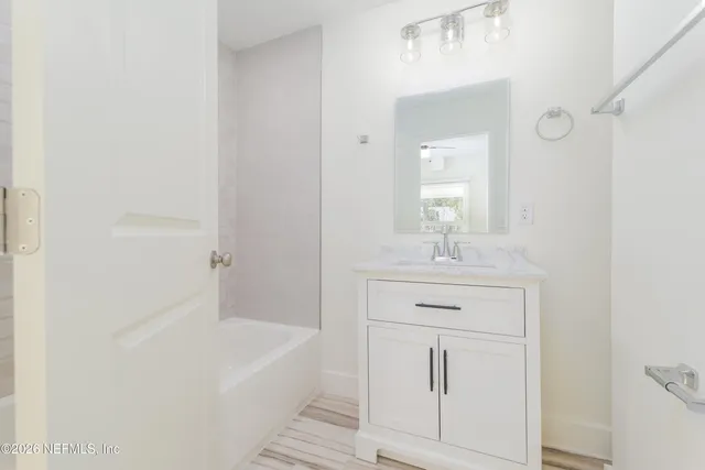 a view of a balcony with wooden floor