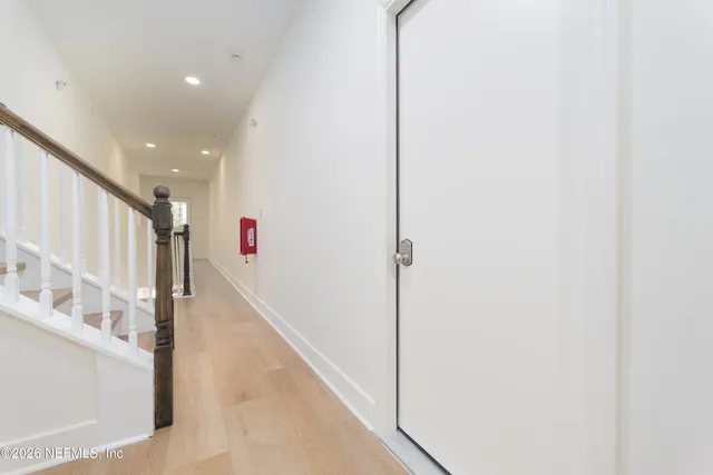 a view of a hallway with windows